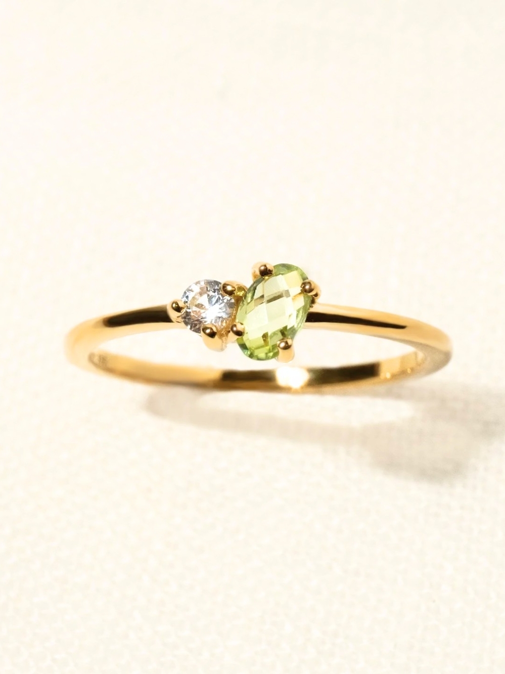 Gold Ring with Green Peridot and White Accent Stone
